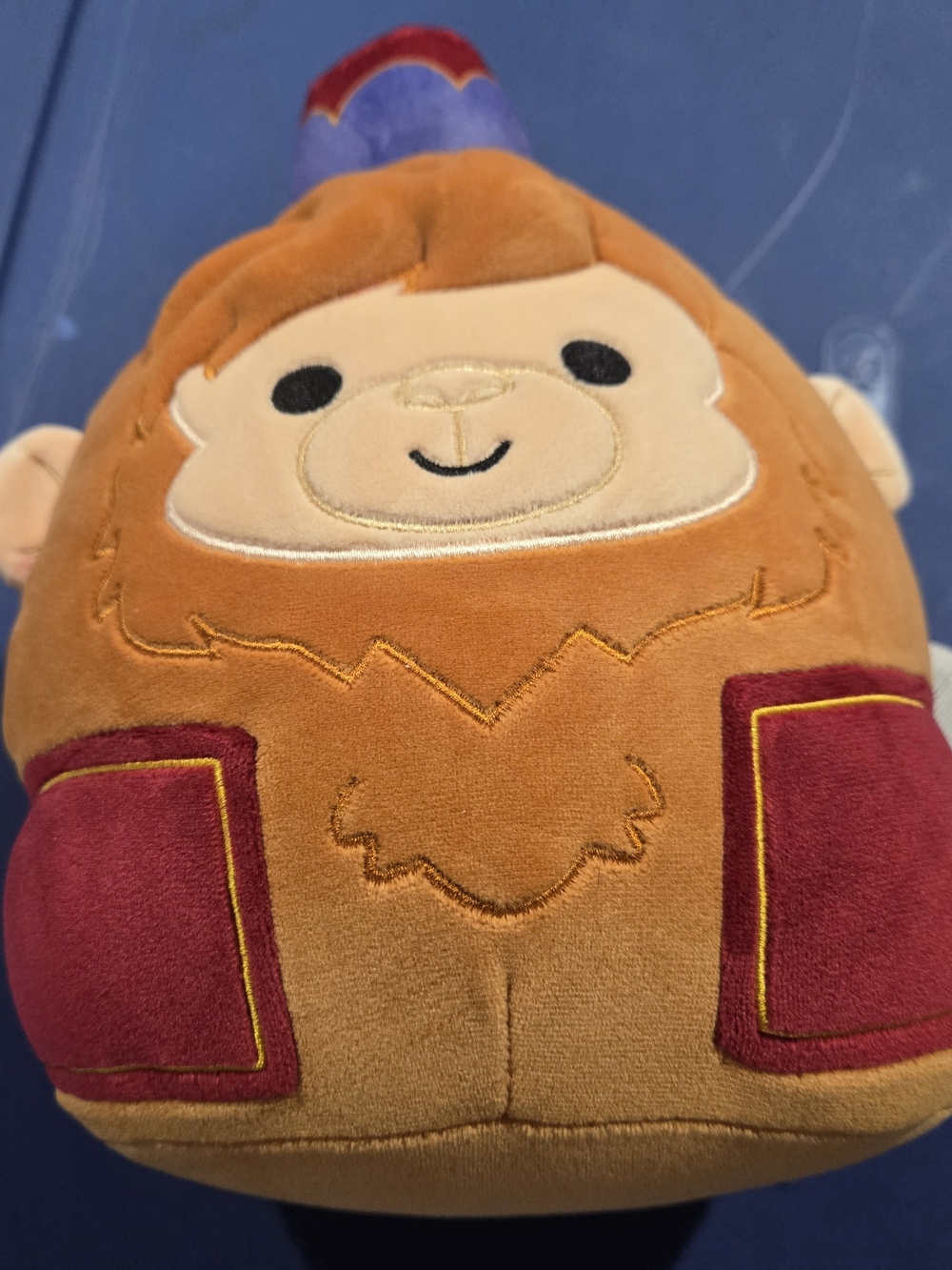 Squishmallows Orange Monkey Plush with Red Pocket Accents